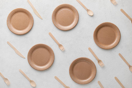 Pattern made of Eco plates and cutlery on white backgroundの写真素材