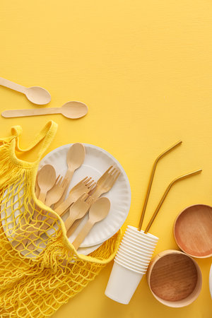 String bag and Eco tableware on yellow backgroundの写真素材
