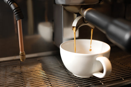 Coffee machine preparing hot espresso in cafeの写真素材