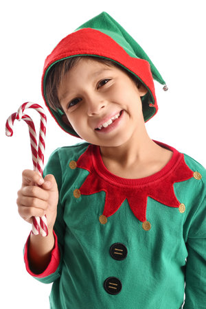 Cute little elf with candy canes on white backgroundの写真素材