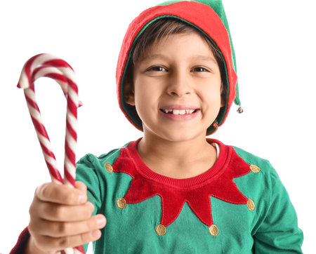Cute little elf with candy canes on white backgroundの写真素材