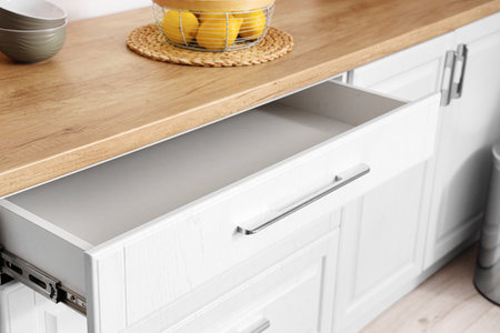 Opened empty drawer in kitchenの写真素材