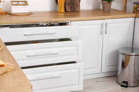 Counter with opened drawers in modern kitchen interiorの写真素材