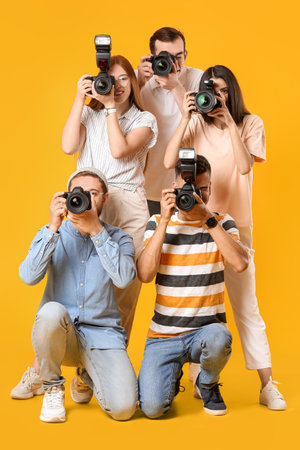 Group of photographers on color backgroundの写真素材