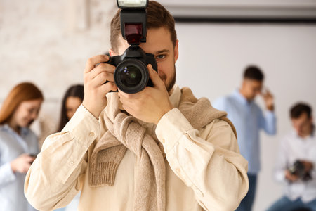 Male photographer during classes in studioの写真素材