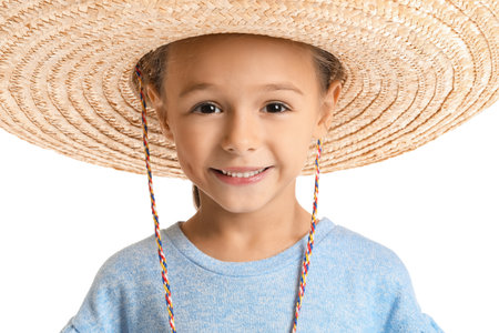 Happy little Mexican girl in sombrero hat on white background, closeupの写真素材