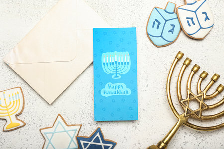Different symbols of Hanukkah, envelope and greeting card on grunge backgroundの写真素材