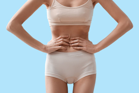 Young skinny woman on color background. anorexia conceptの写真素材