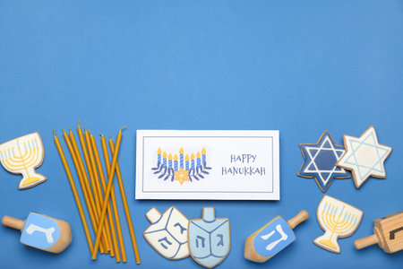Different symbols of Hanukkah and greeting card on color backgroundの写真素材