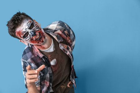 Scary zombie man on color background