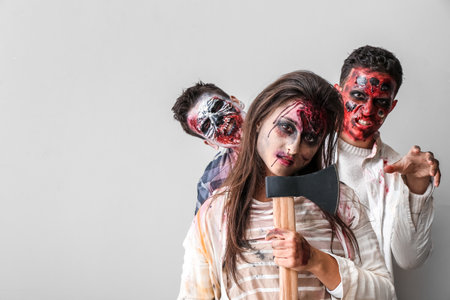 Scary zombies on light background