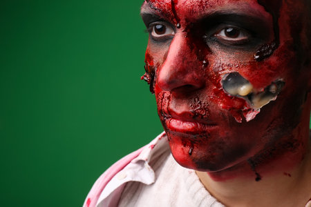 Scary zombie man on color background, closeupの写真素材