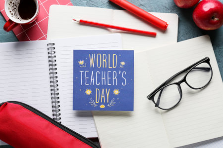 Concept of Teacher's Day. Greeting card and school supplies, top view