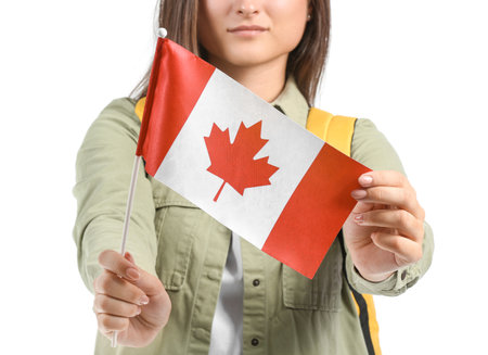 Young female student with national flag of Canada on white background, closeupの写真素材