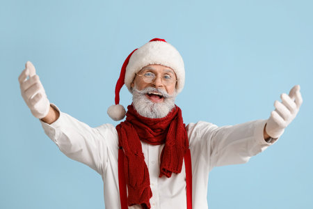 Portrait of happy Santa Claus on color backgroundの写真素材