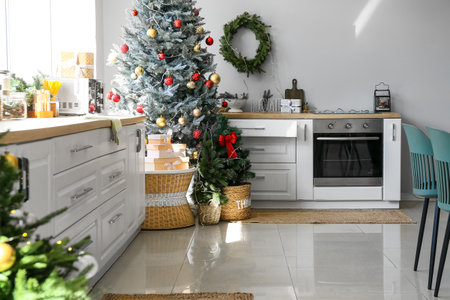 Interior of modern kitchen with beautiful Christmas treeの写真素材
