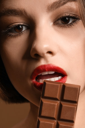 Beautiful woman with sweet chocolate, closeup