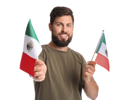 Handsome man with Mexican flags on white backgroundの写真素材