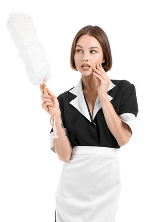 Portrait of beautiful chambermaid with pp duster on white backgroundの写真素材