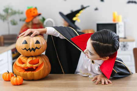 Cute little boy celebrating Halloween at homeの写真素材