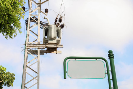 View of electric pole and blank signboard in city, closeup
