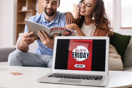 Couple shopping online on Black Friday at home