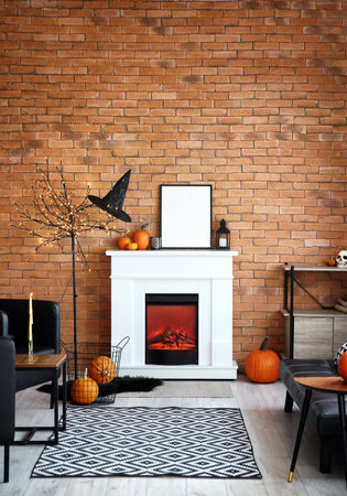 Fireplace with frame in living room decorated for Halloweenの写真素材
