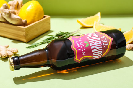 Bottle of natural kombucha on table, closeup