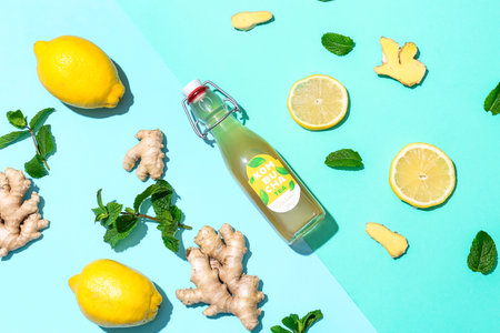 Composition with bottle of tasty kombucha on color backgroundの写真素材