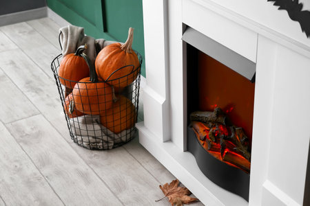 Fireplace decorated for Halloween party in roomの写真素材