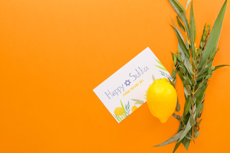 Sukkot festival symbols and greeting card on color backgroundの写真素材