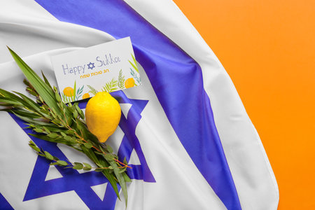 Sukkot festival symbols, flag of Israel and greeting card on color backgroundの写真素材