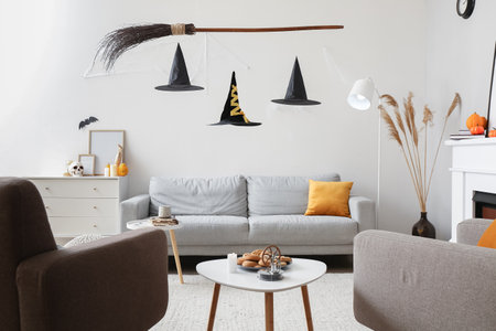 Interior of living room with creative witch's decorations for Halloween