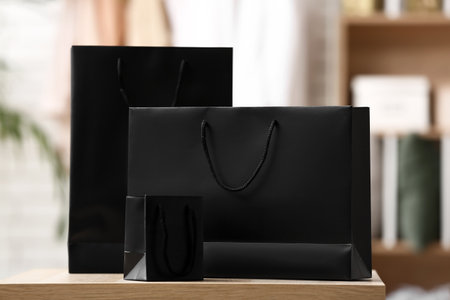 Shopping bags on table in store. black friday saleの写真素材