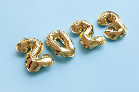 Figure 2023 made of balloons on blue backgroundの写真素材