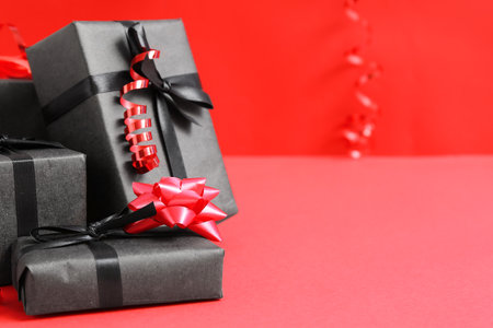 Gift boxes on red background. black friday sale