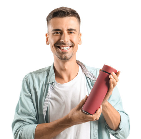 Handsome young man with flask on white backgroundの写真素材