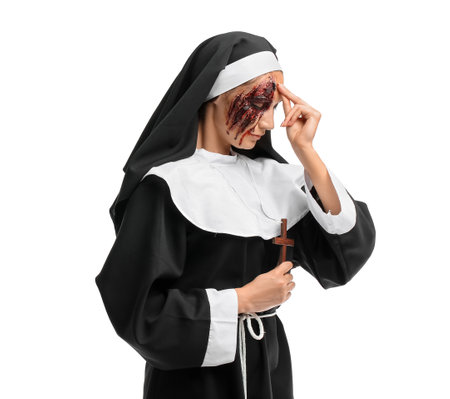 Woman dressed for Halloween as nun on white backgroundの写真素材