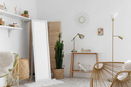 Mirror, different decor and word DREAM on table near light wall in room interiorの写真素材