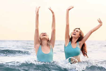 Beautiful young women swimming in the seaの写真素材