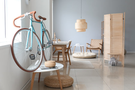 Comfortable interior of living room with modern bicycleの写真素材