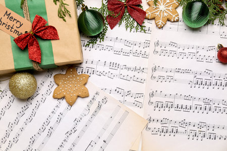 Christmas gift with cookies and decor on note sheetsの写真素材