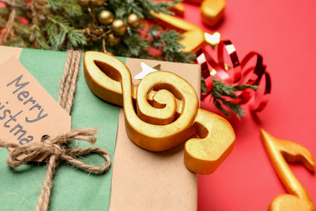 Christmas gift with note sign on red background, closeupの写真素材
