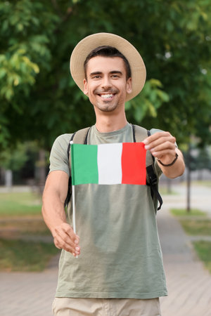 Male tourist with Italian flag outdoorsの写真素材