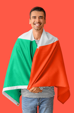 Young man with Italian flag on color backgroundの写真素材
