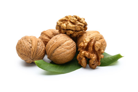 Heap of fresh walnuts on white background