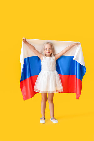 Cute little girl with national flag of Russia on color backgroundの写真素材