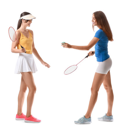 Sporty female badminton players on white backgroundの写真素材
