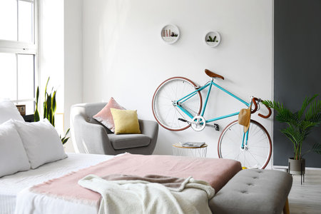 Interior of modern stylish bedroom with bicycleの写真素材