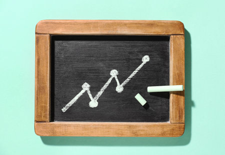 Board with drawing of diagram on color backgroundの写真素材